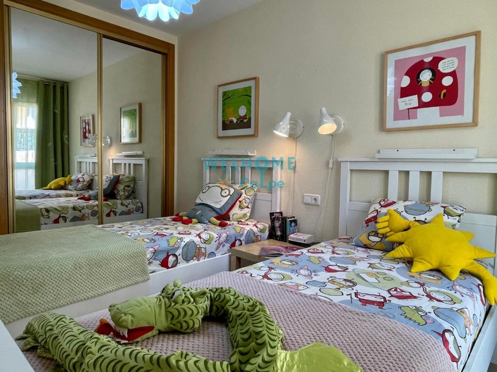 Postel nebo postele na pokoji v ubytování MANZANA bonito y cómodo apartamento con piscina