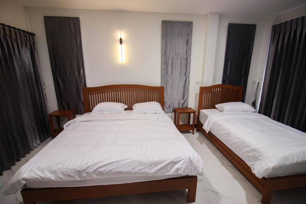 Postel nebo postele na pokoji v ubytování BK Hotel