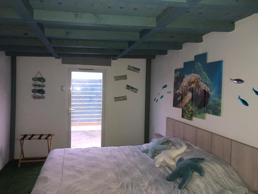 Postel nebo postele na pokoji v ubytování Aruba Local Stay