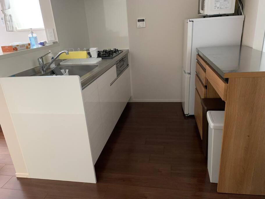 Kuchyň nebo kuchyňský kout v ubytování Maizon de Aile Room D