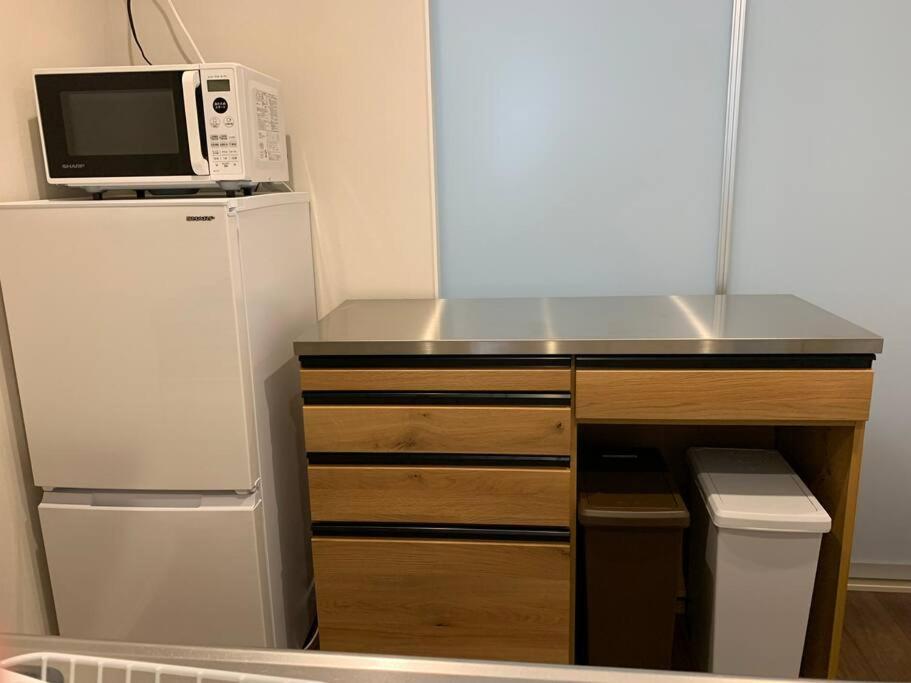Kuchyň nebo kuchyňský kout v ubytování Maizon de Aile Room D