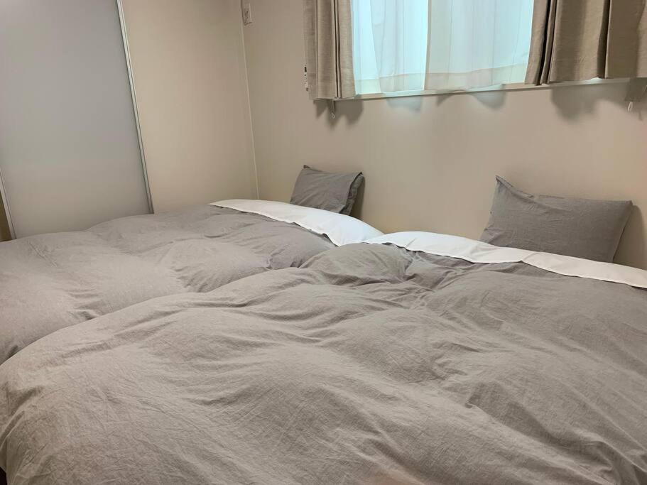 Postel nebo postele na pokoji v ubytování Maizon de Aile Room D