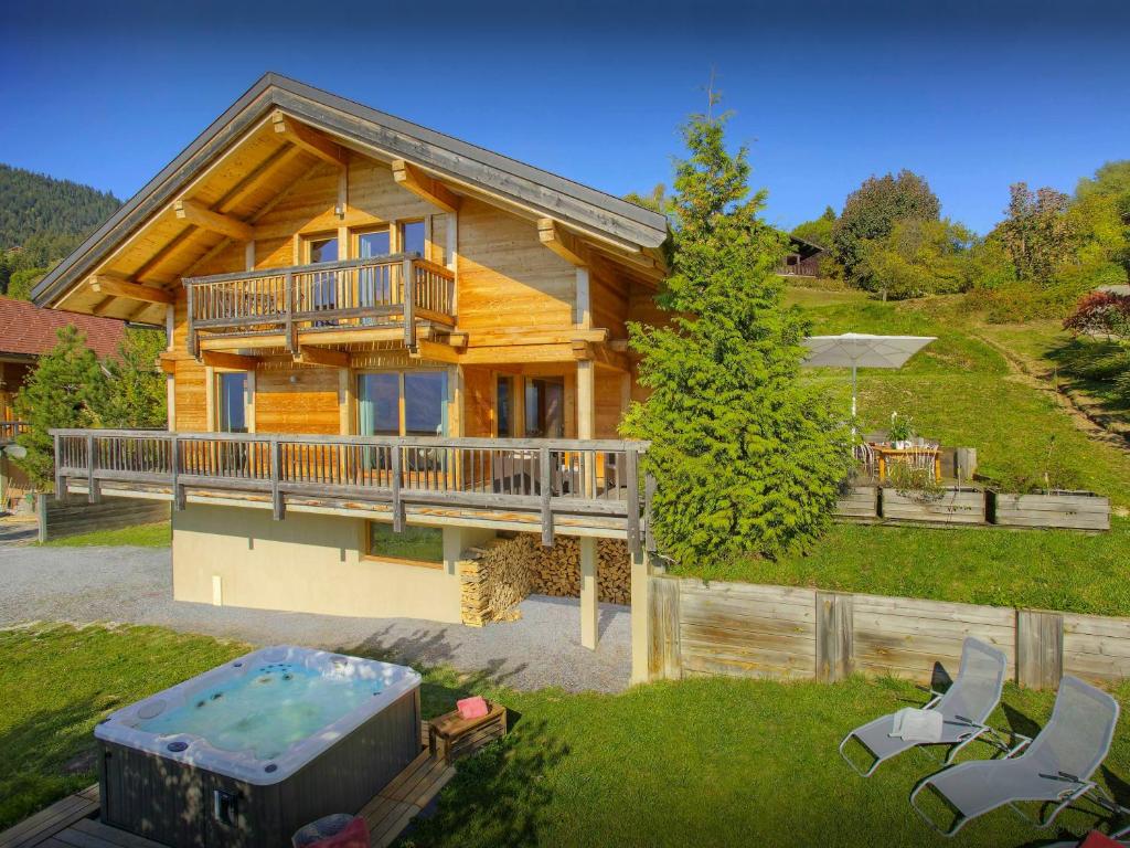 an overhead view of a log house with a pool at Chalet Parakima - OVO Network in Manigod