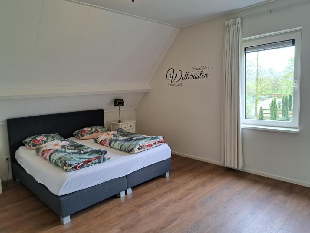 Postel nebo postele na pokoji v ubytování Vakantiehuis B&B Familie Versantvoort