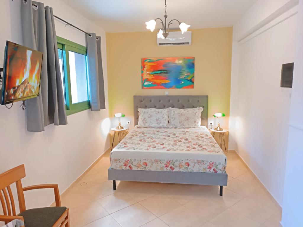 Postel nebo postele na pokoji v ubytování Okeanis Apartments & Suites Adults Only