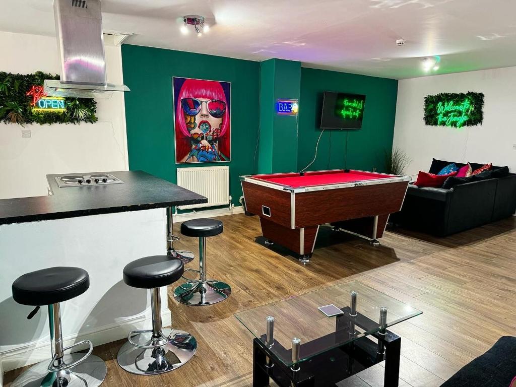 a living room with a pool table and a couch at Liverpool City Centre - Spacious Duplex - 6 Bedrooms - Sleeps 14 People in Liverpool