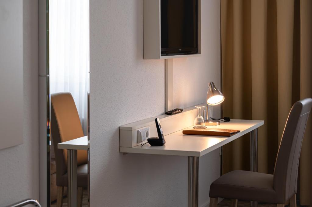 TV a/nebo společenská místnost v ubytování Hotel Astra