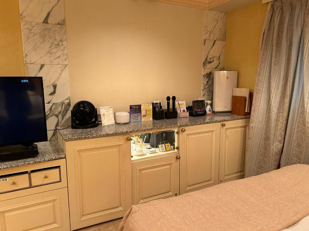 Kuchyň nebo kuchyňský kout v ubytování Hotel Grand Garden (Adult Only)