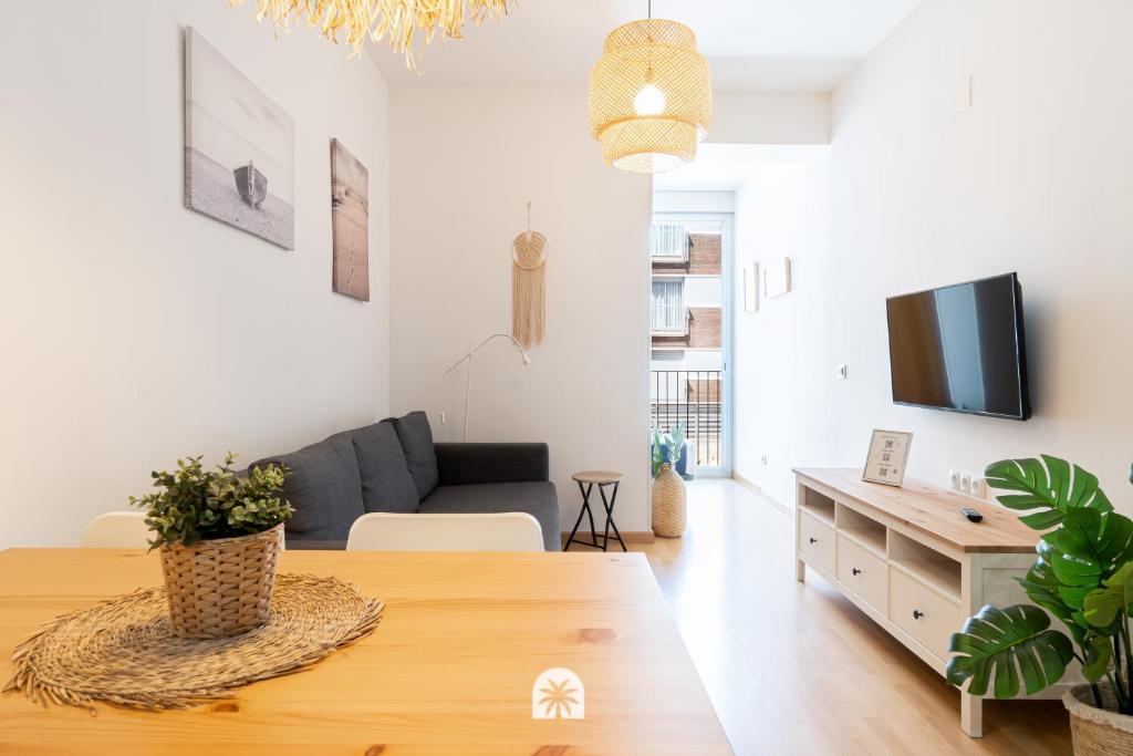 a living room with a couch and a table at Mediterranean Way - Tarragona Central Apartments in Tarragona