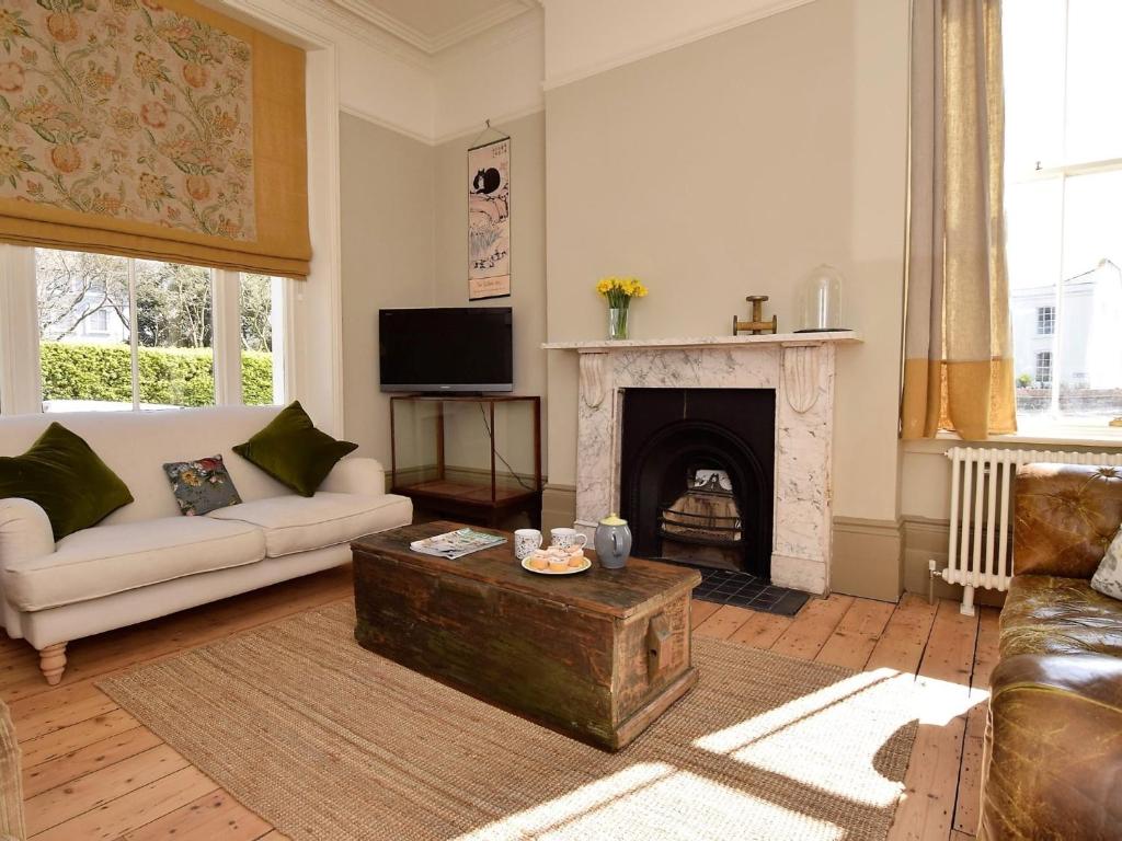 a living room with a couch and a fireplace at 5 bed property in Hastings Sussex 57217 in Hollington