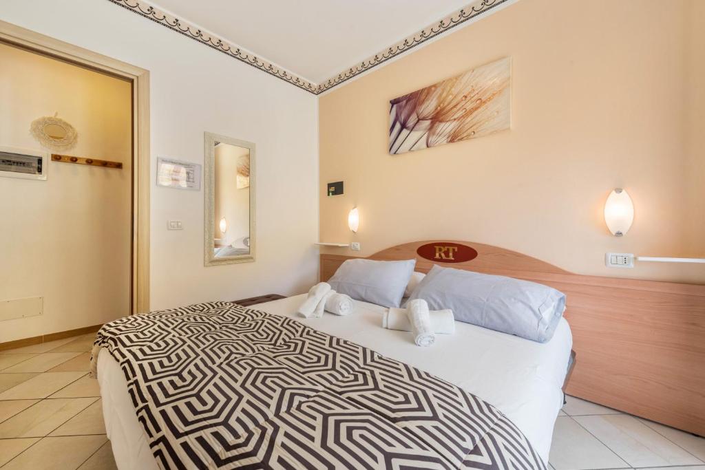 Postel nebo postele na pokoji v ubytování Residence Tatiana A2