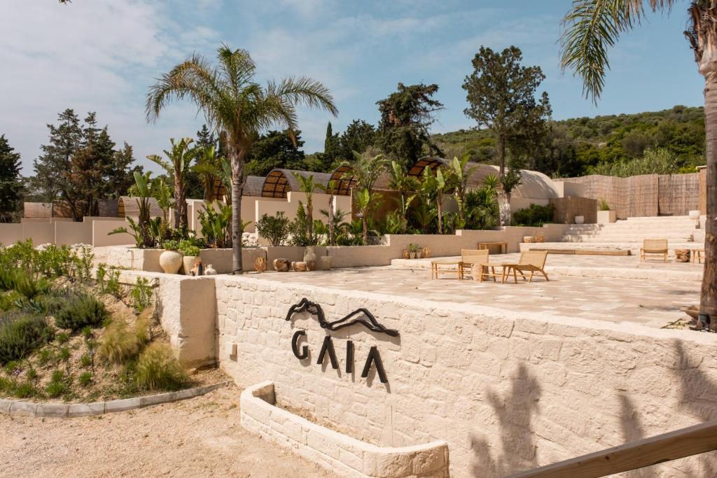 a stone wall with a sign that says cara at GAIA Alaçatı BY THE SEA - Adult Only in Çeşme