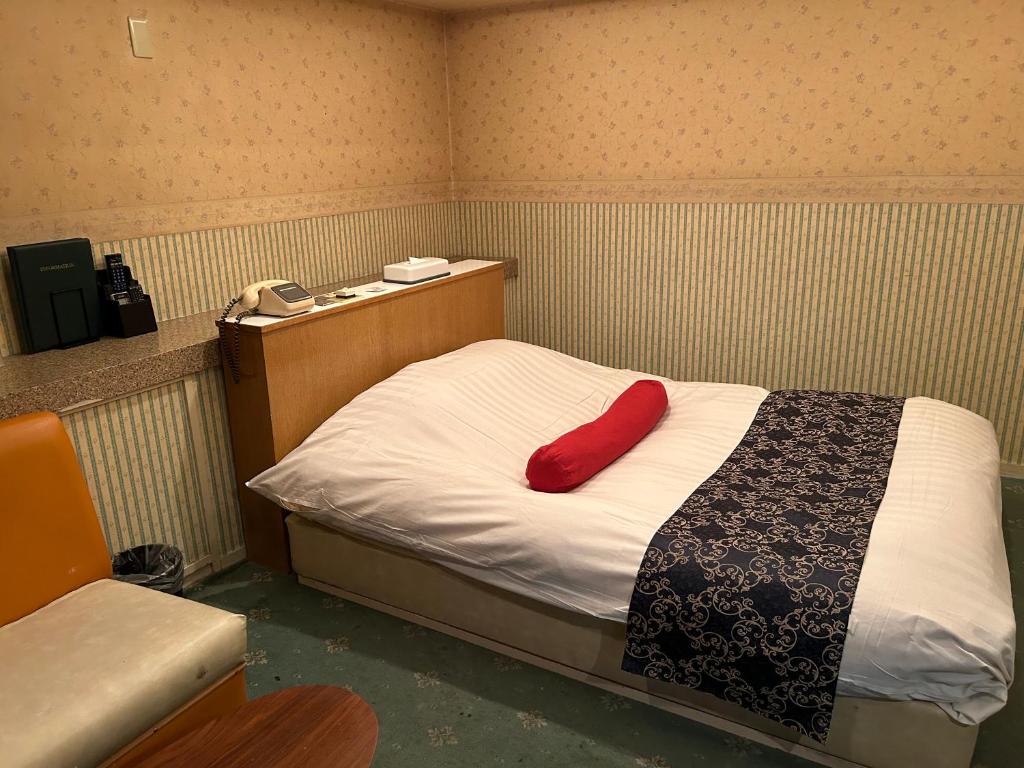 Postel nebo postele na pokoji v ubytování ホテルアイエス