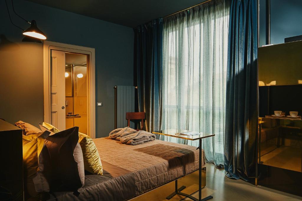Postel nebo postele na pokoji v ubytování Boutique Hotel Borgo Nuovo