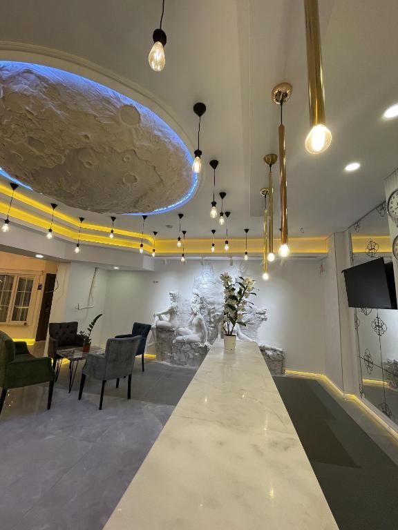 TV a/nebo společenská místnost v ubytování Mi Hotel Boutique