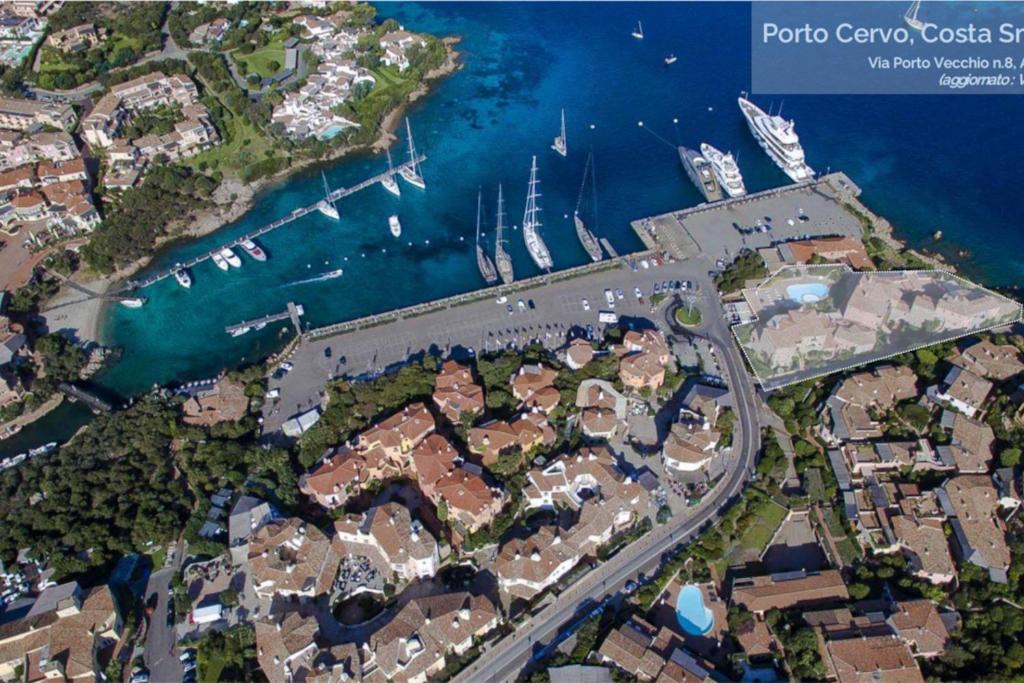 an aerial view of a harbor with houses and boats at Waterfront Port House in Porto Cervo
