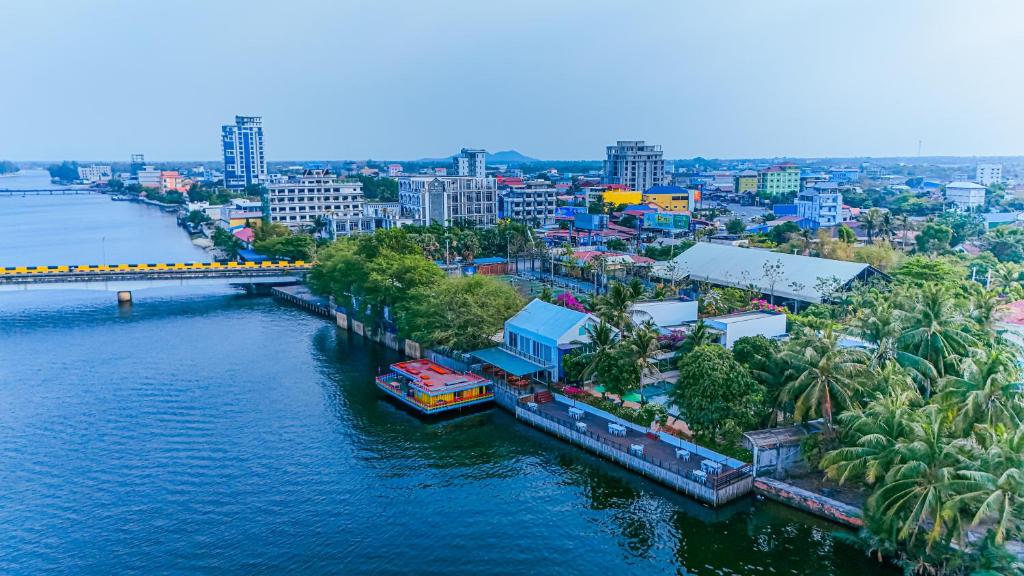 an aerial view of a river with a city at The B Resort in Kampot