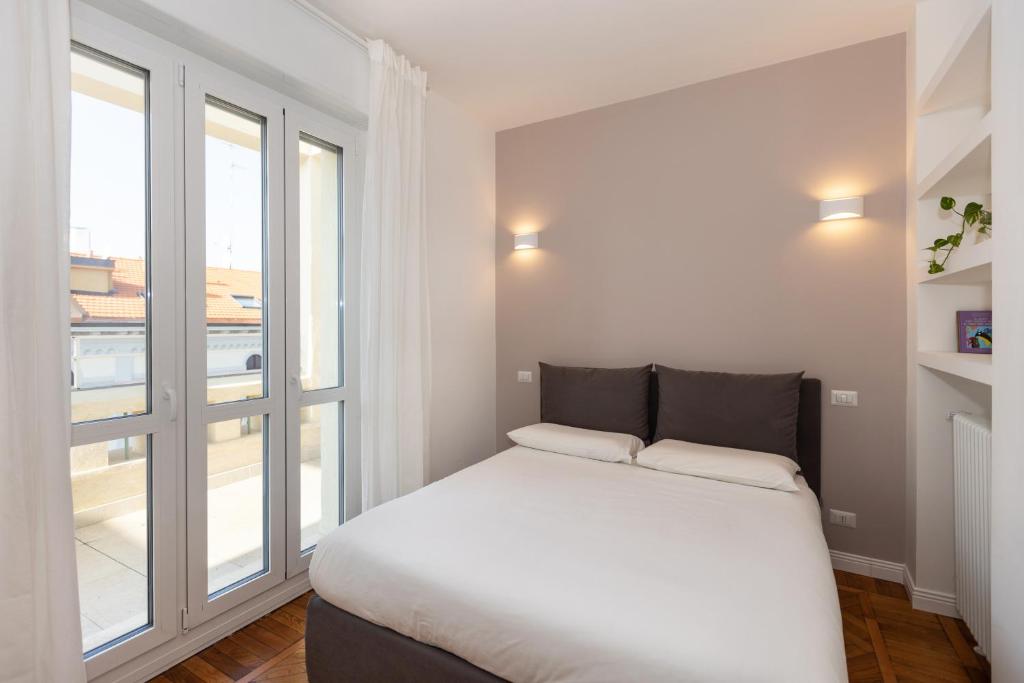 A bed or beds in a room at Gaffurio Apartments
