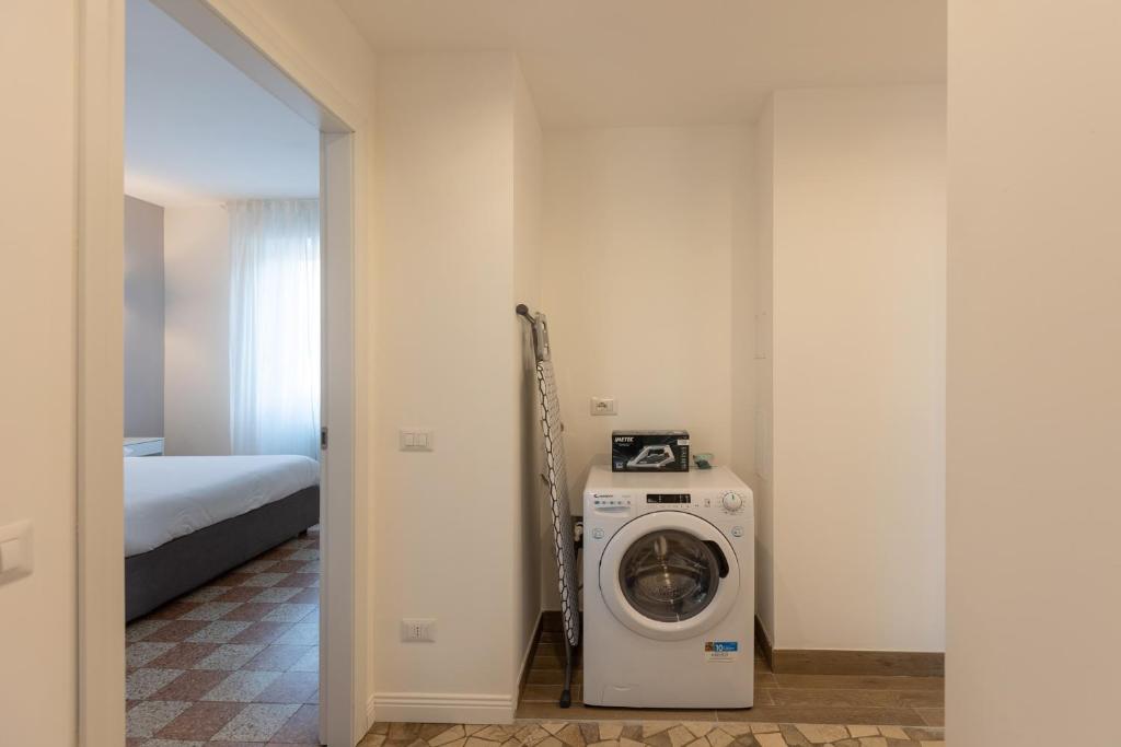 A bed or beds in a room at Gaffurio Apartments