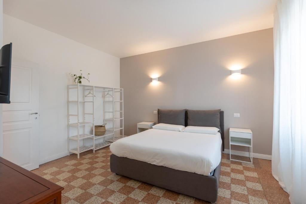 A bed or beds in a room at Gaffurio Apartments