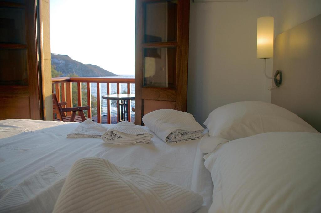 Postel nebo postele na pokoji v ubytování Villa Patmos Netia - Location Xoxlakas