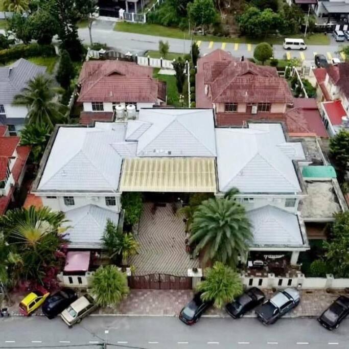 an aerial view of a house with cars parked in front at Omar Little Palace - 10 Bedroom Homestay Seremban in Seremban