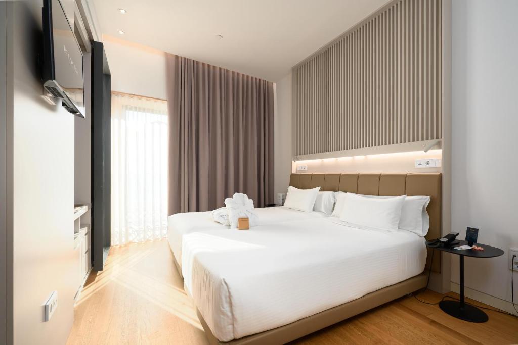 Postel nebo postele na pokoji v ubytování Hotel Kivir