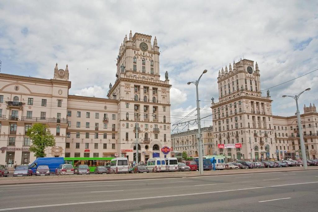 a large building with two towers on a city street at Vokzal Kirova 1 (2) in Minsk