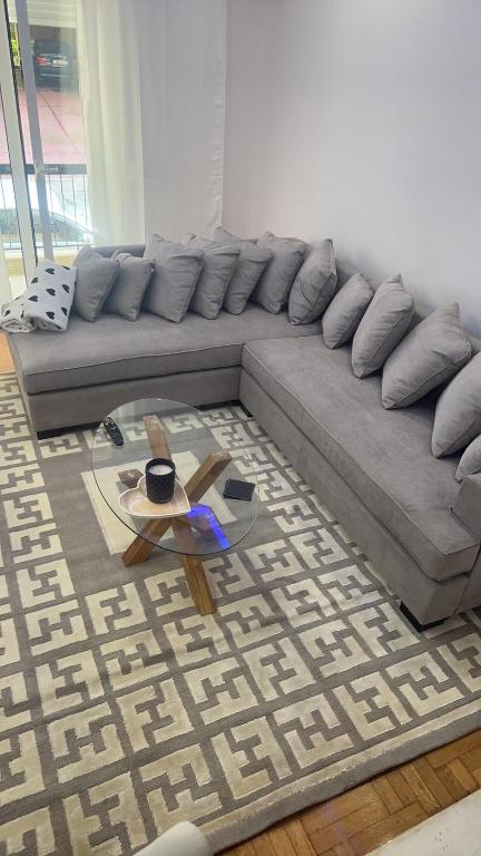 a living room with a couch and a coffee table at Maria's luxury apartment in Athens