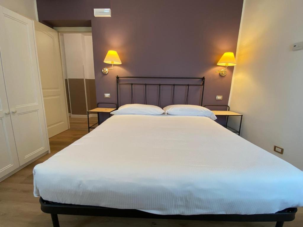 Łóżko lub łóżka w pokoju w obiekcie Locanda Moscal