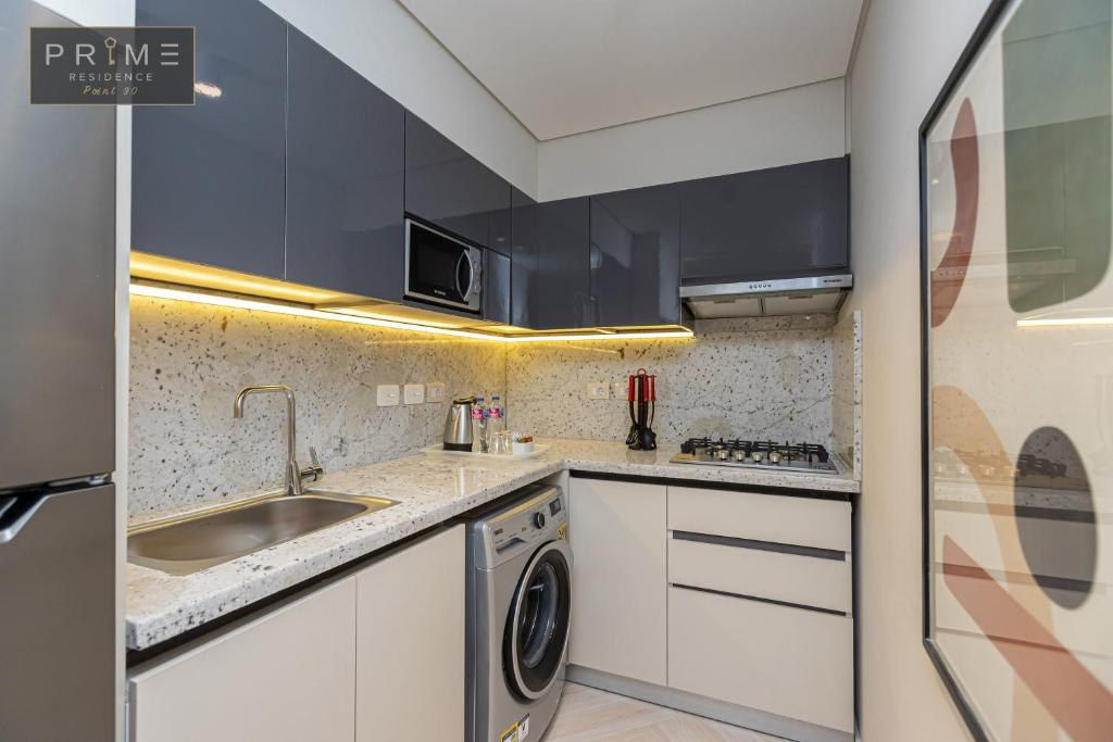 Kuchyň nebo kuchyňský kout v ubytování Prime Residence Point 90