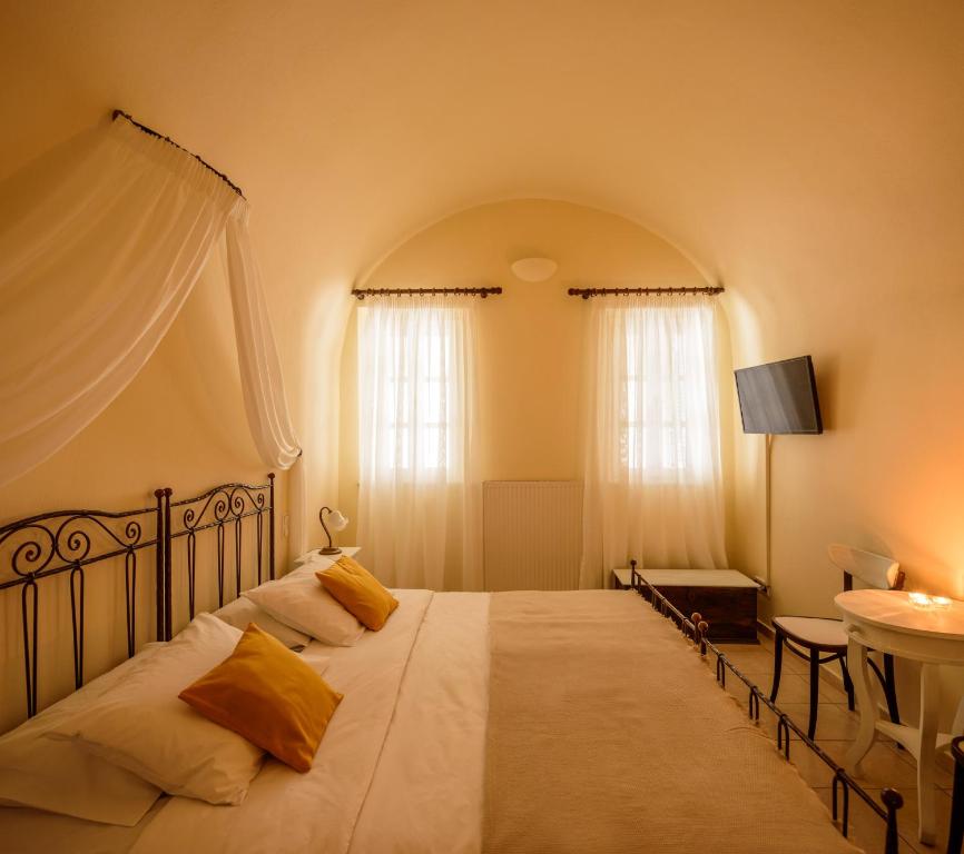 Letto o letti in una camera di Ikio Concept Santorini