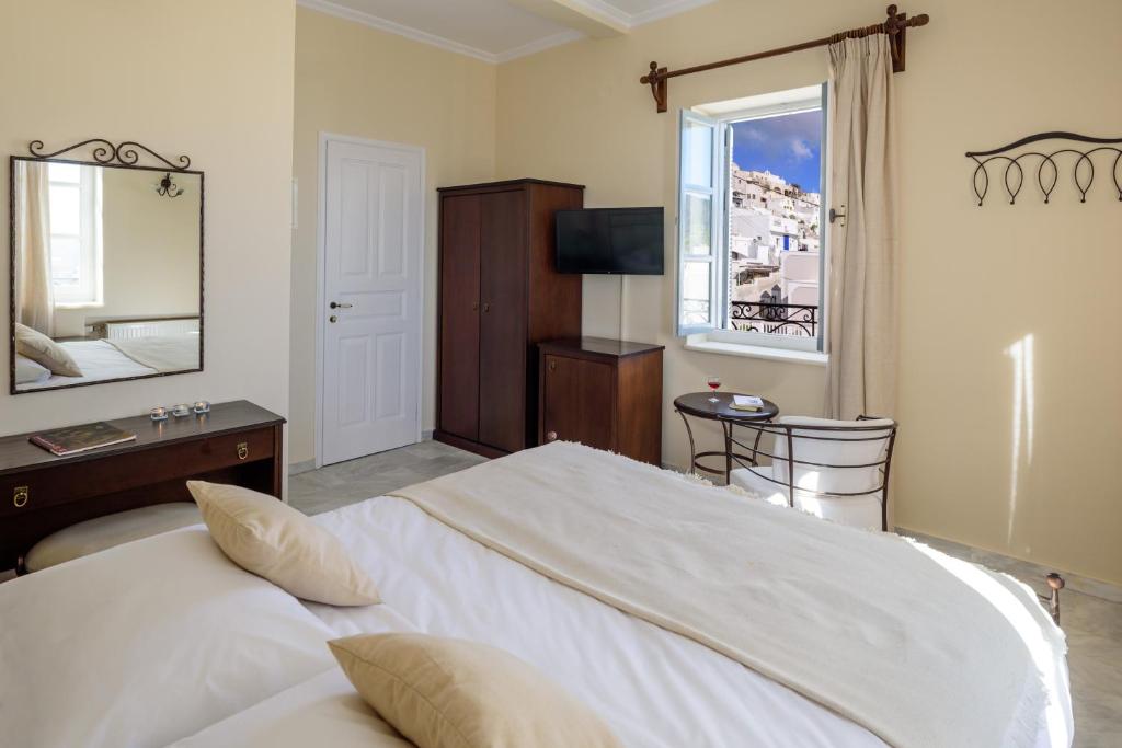 Letto o letti in una camera di Ikio Concept Santorini