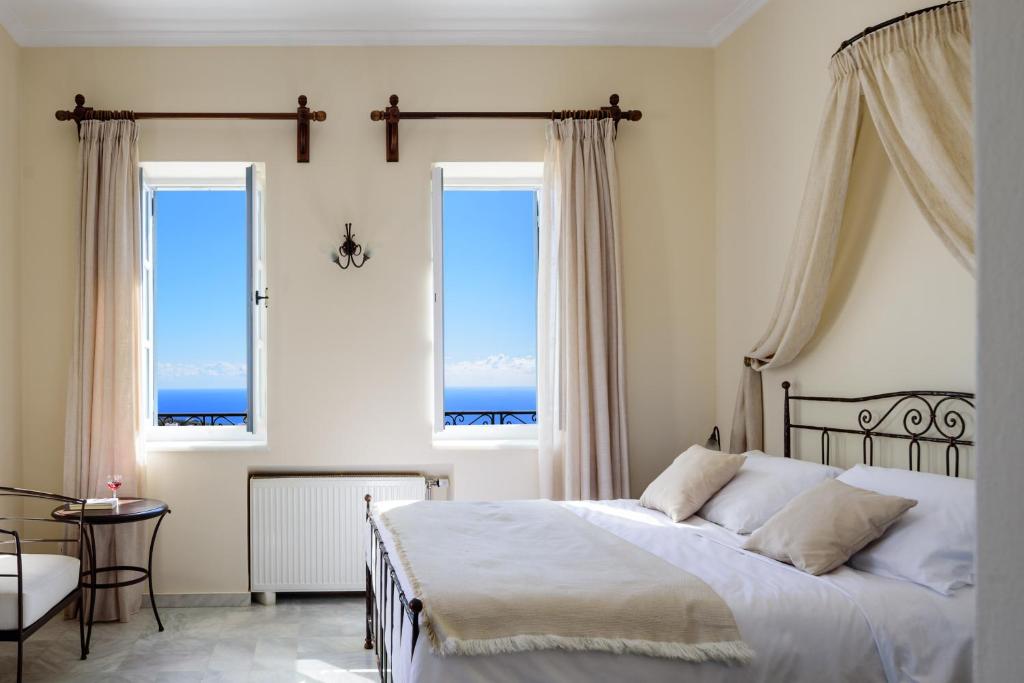 Letto o letti in una camera di Ikio Concept Santorini