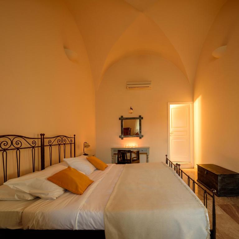 Letto o letti in una camera di Ikio Concept Santorini