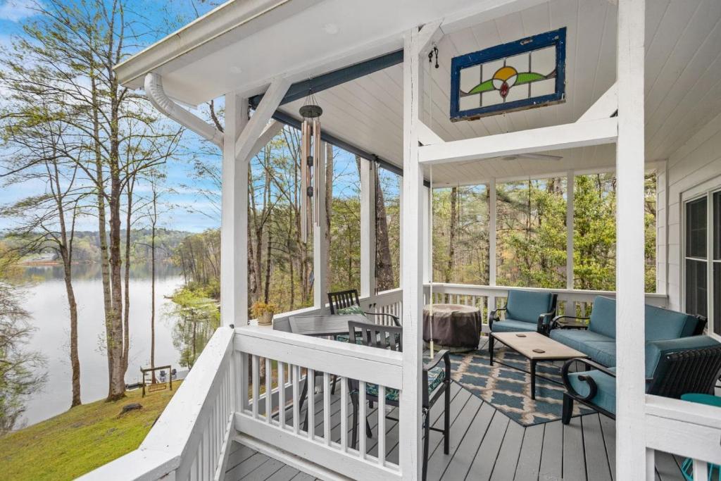 a screened in porch with a view of a lake at Bella Di Lago in Wilkesboro