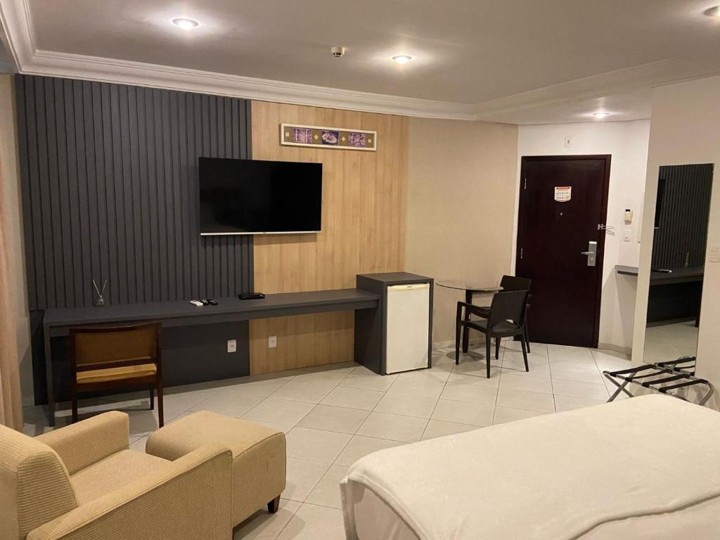 Una televisión o centro de entretenimiento en Millenium Hotel Flat