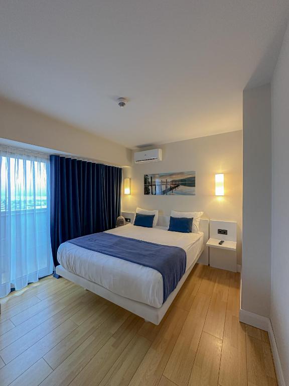 Postel nebo postele na pokoji v ubytování Luxury Batumi Hotel