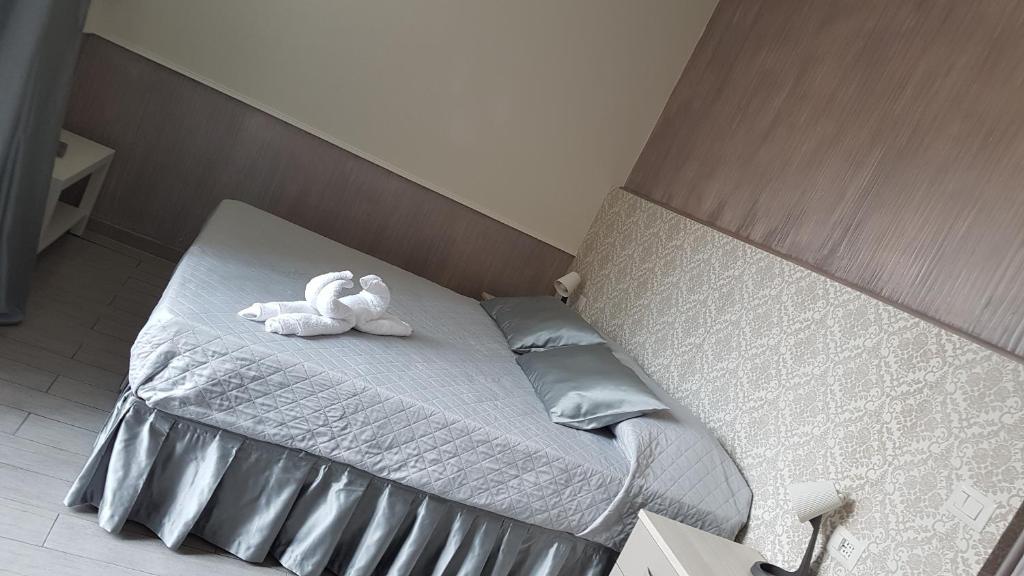 Posteľ alebo postele v izbe v ubytovaní ILLUVIA affitto camere
