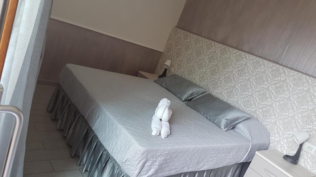 Posteľ alebo postele v izbe v ubytovaní ILLUVIA affitto camere
