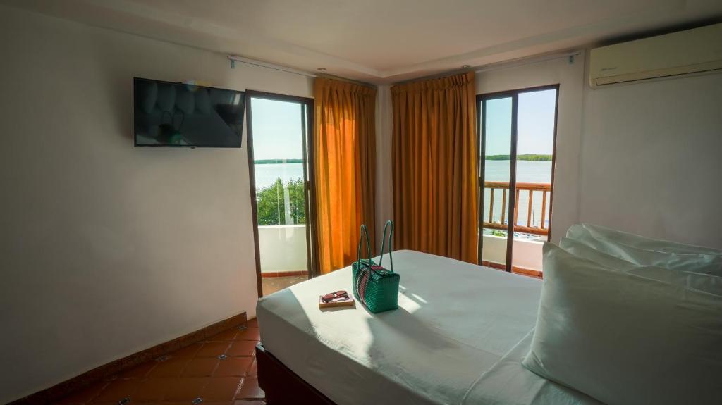 Postel nebo postele na pokoji v ubytování Hotel Rio Lagartos
