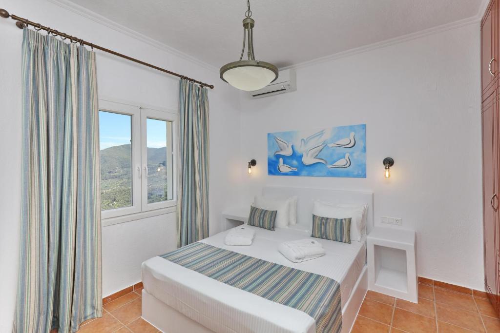 Postel nebo postele na pokoji v ubytování Liagka Villa
