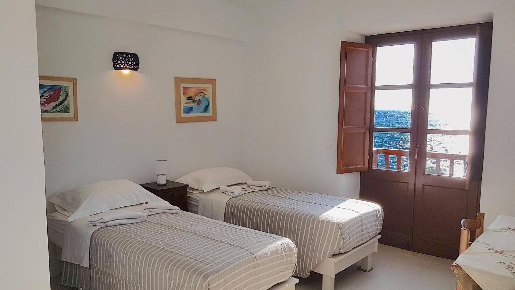 Postel nebo postele na pokoji v ubytování Villa Patmos Netia - Location Xoxlakas