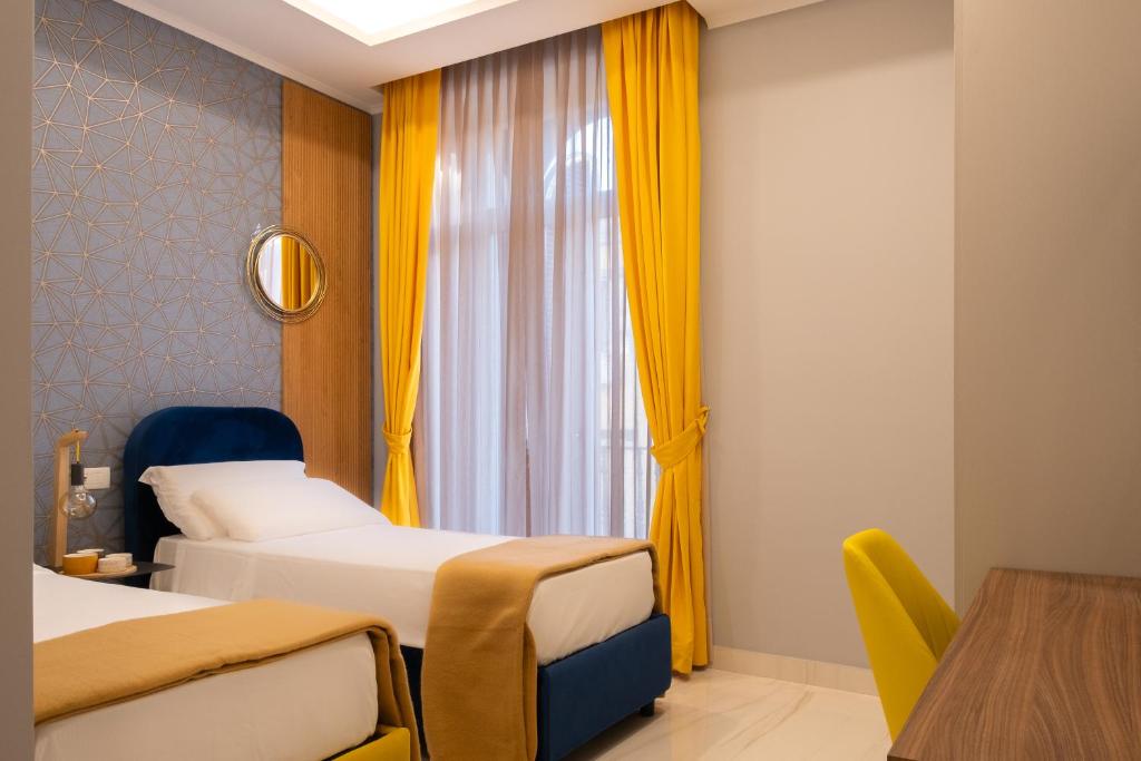 Postel nebo postele na pokoji v ubytování Palazzo Adele Rooms & Apartments