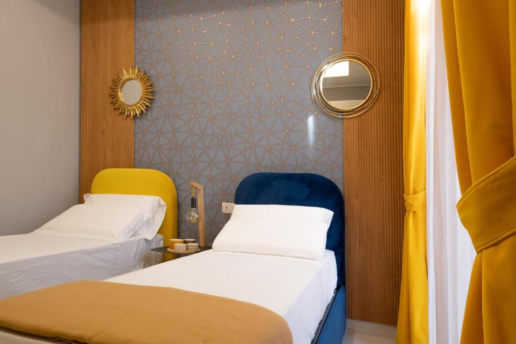 Postel nebo postele na pokoji v ubytování Palazzo Adele Rooms & Apartments