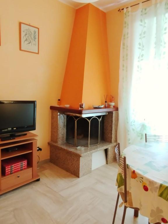 TV a/nebo společenská místnost v ubytování Casa di Anna