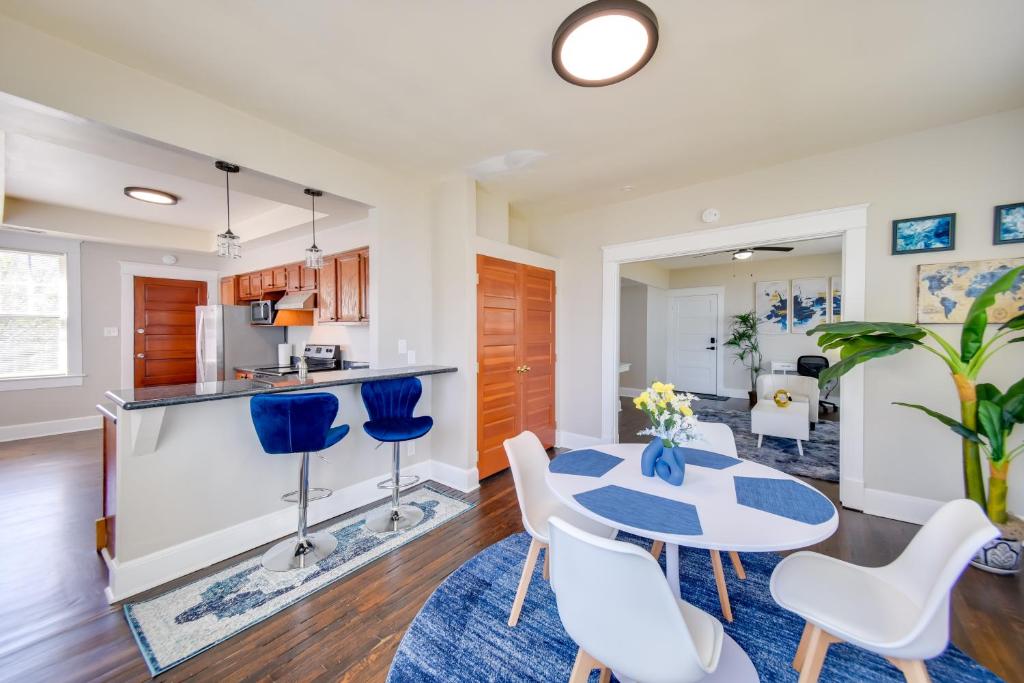 a kitchen and living room with a table and chairs at Modern Portsmouth Apartment Walk to Norfolk Ferry in Portsmouth