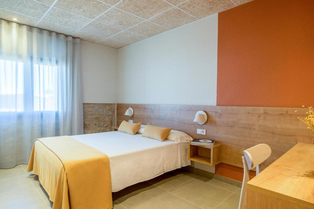 Postel nebo postele na pokoji v ubytování Hostal Barris