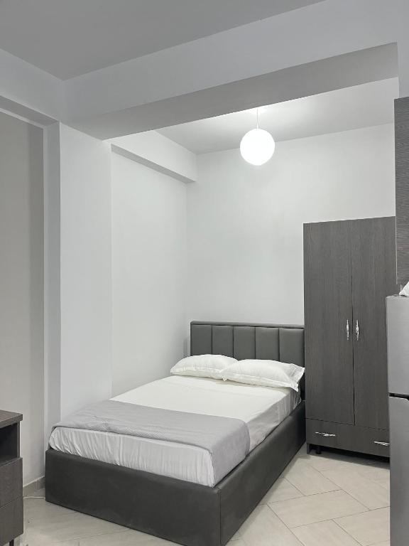 Postel nebo postele na pokoji v ubytování Blossom Apartments