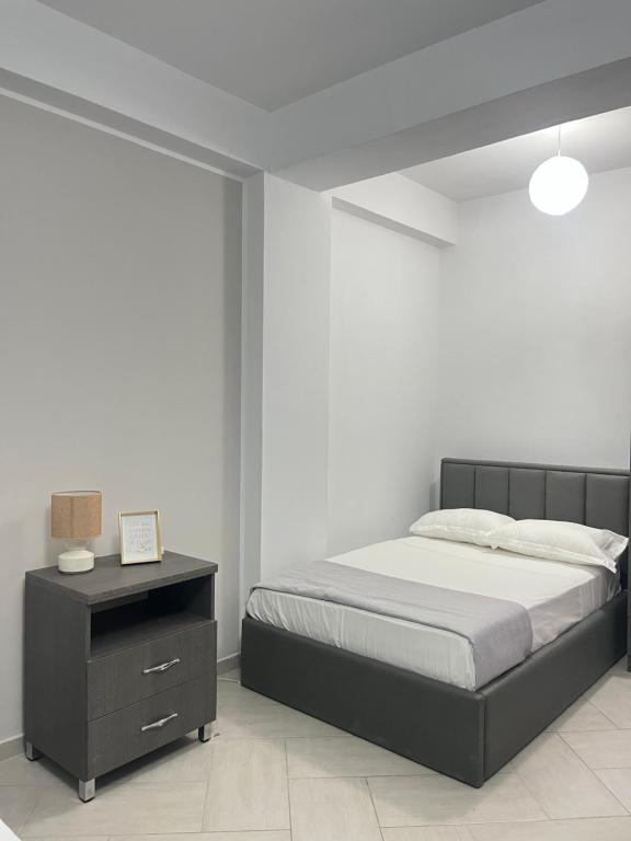 Postel nebo postele na pokoji v ubytování Blossom Apartments